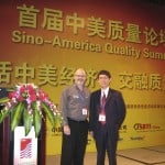 Photo Fred Schenkelberg and Feng-bin Sun on stage of Sino-American Quality Summit, in Guangdong, China